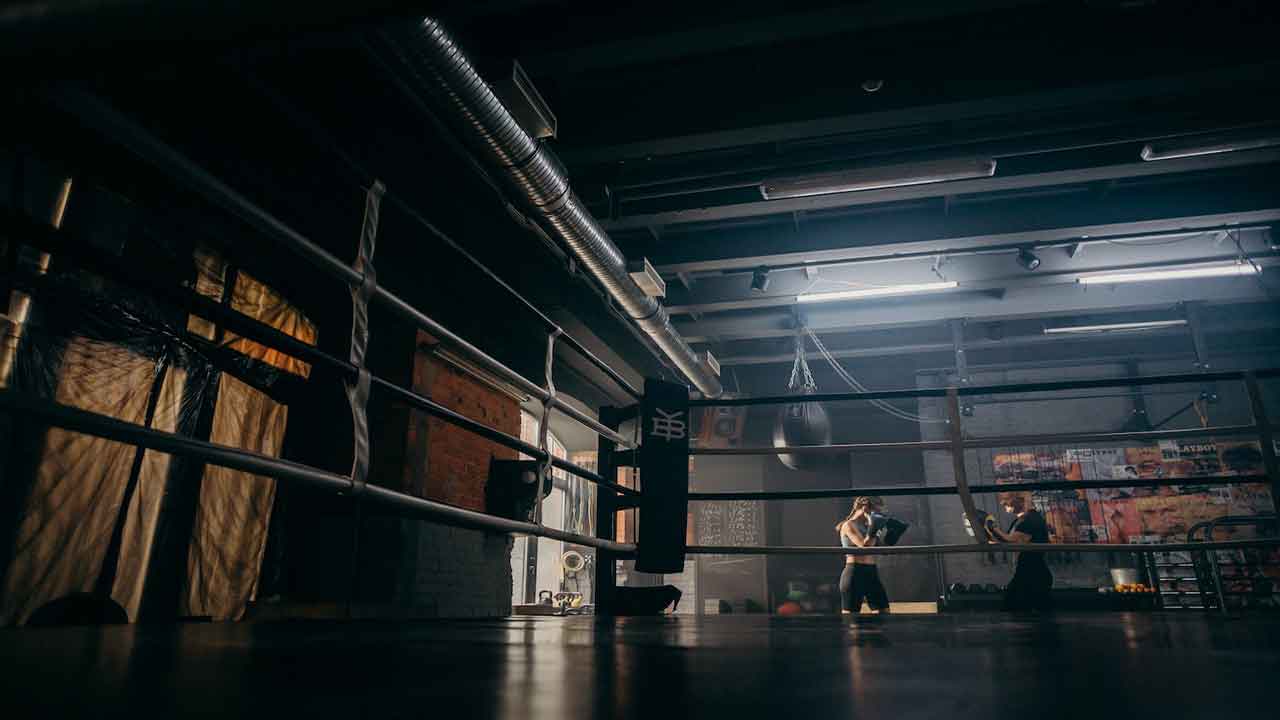 a man sweeping a floor with a text revealing with graphics